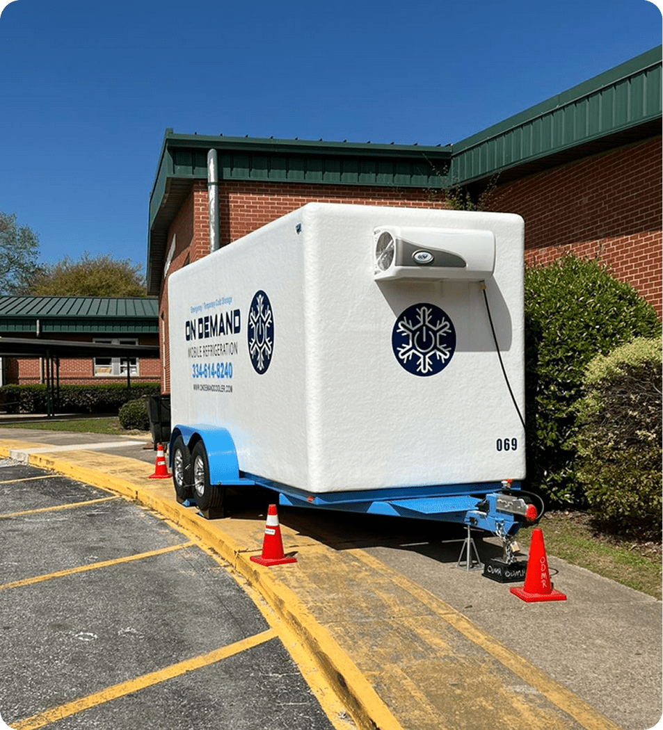 Mobile refrigeration unit outside brick building