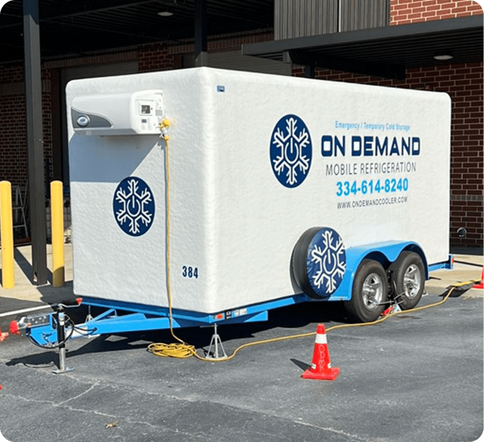 Mobile refrigeration trailer parked outside building