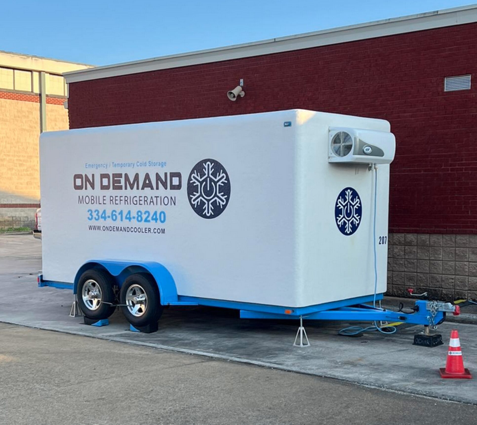 Mobile refrigeration trailer parked outside building